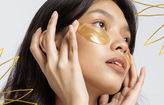Woman wearing gold undereye masks